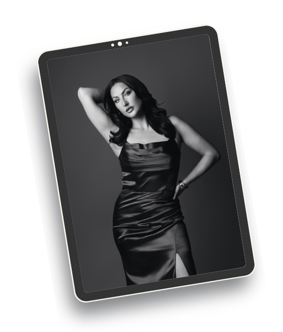 woman on ipad with a gorgeous dress in a studio session