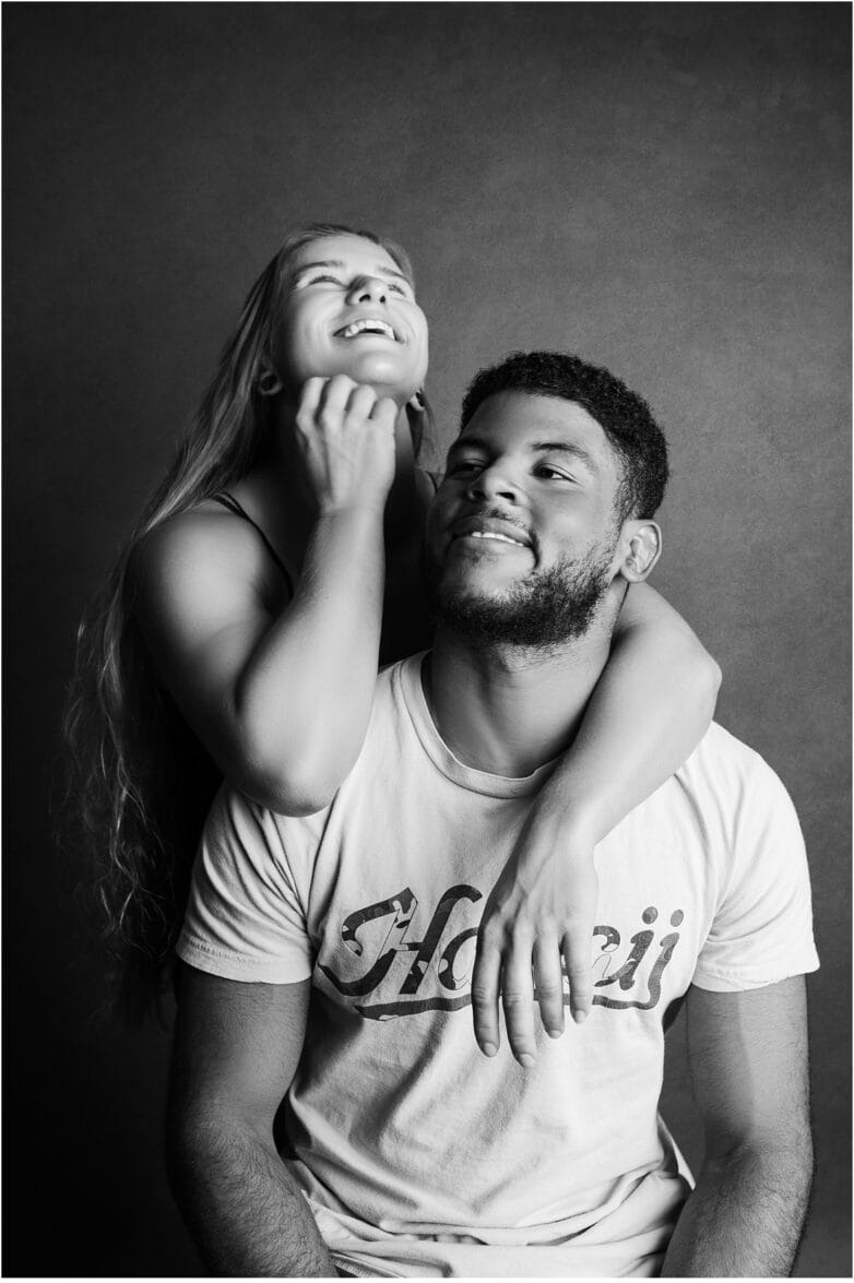 Studio couples photo of two people in love, captured during a styled shoot in Phoenix with high-contrast lighting.