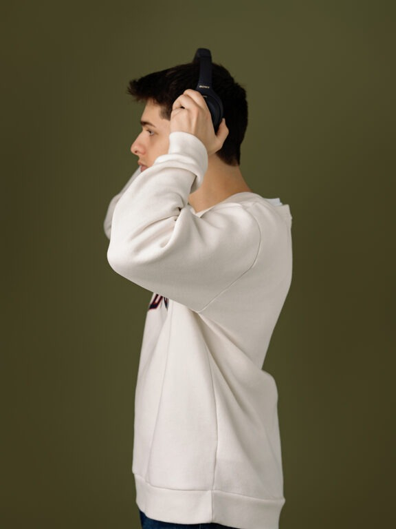 boy wearing beats headsets listening to music