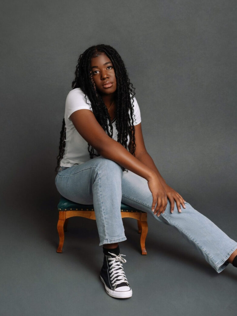 beautiful black girl in a studio senior picture in phoenix
