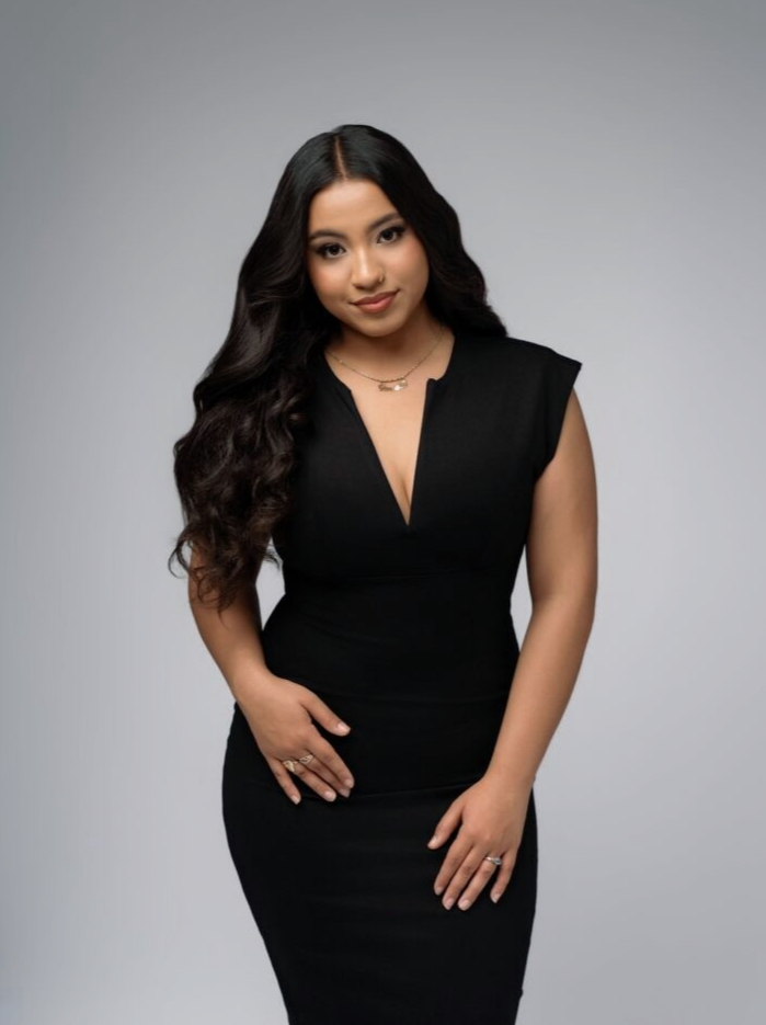 graduation photo of a girl wearing a black dress